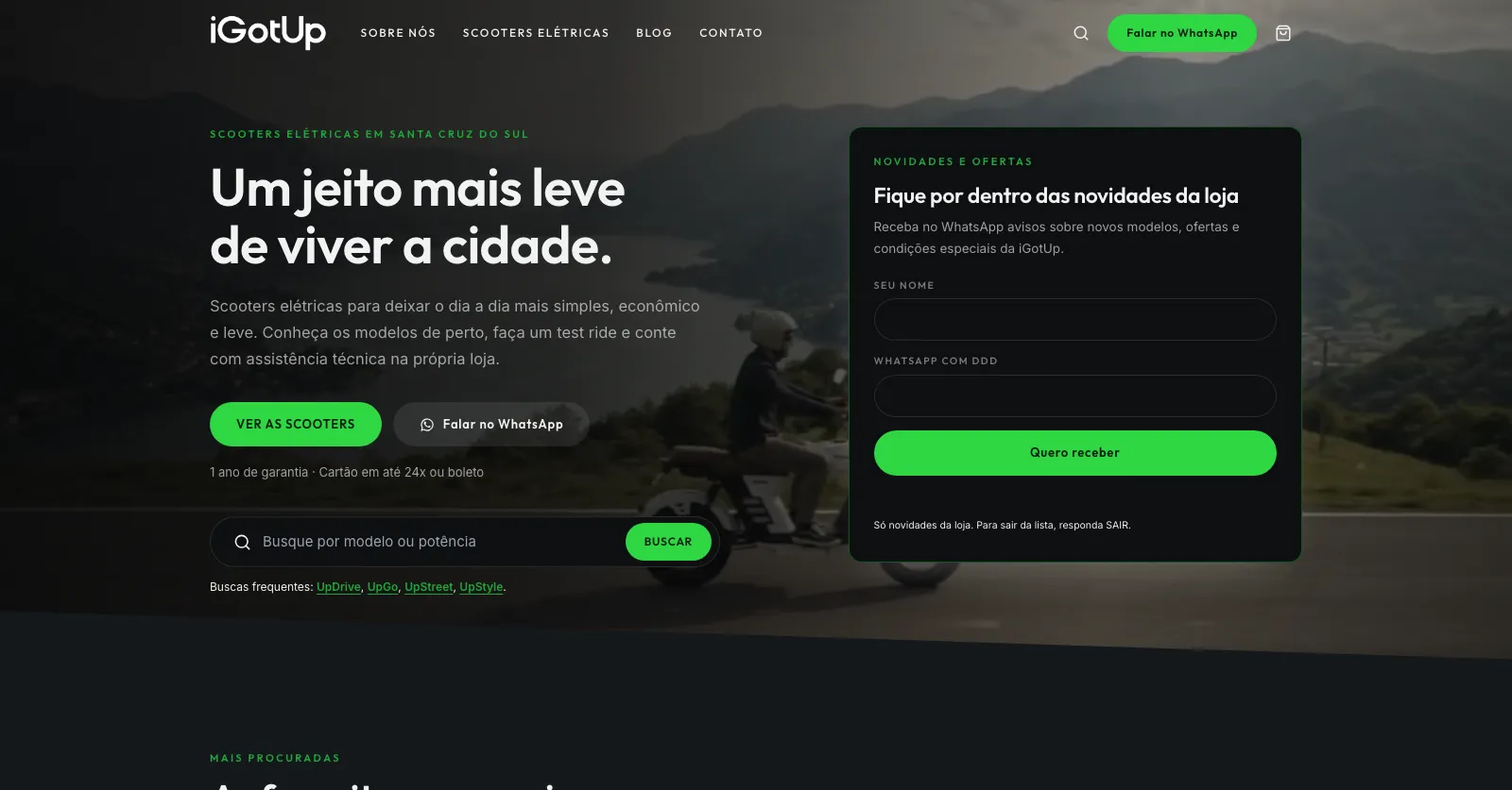 Página inicial do site da iGotUp: foto de uma scooter elétrica na estrada, o título "Um jeito mais leve de viver a cidade" e a lista de novidades pelo WhatsApp